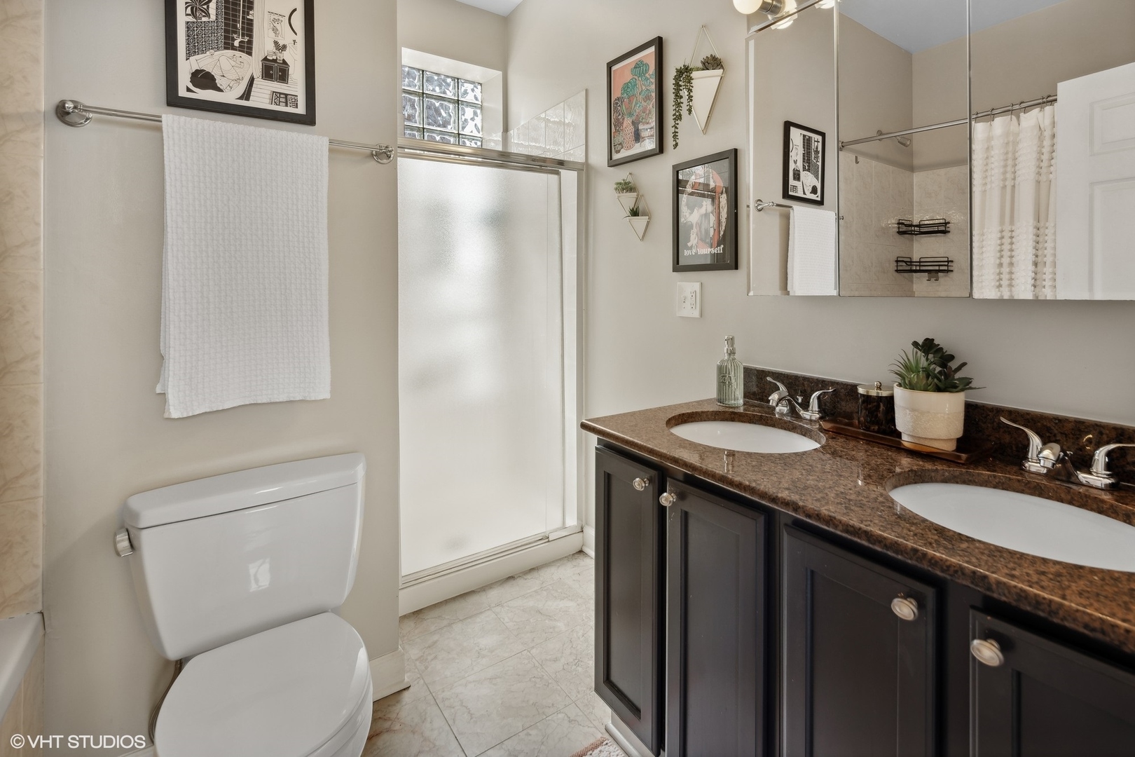 1326 West Huron Street, Unit 4 Chicago, IL 60642 - Photo 17 of 20 a bathroom with a granite countertop sink toilet and shower