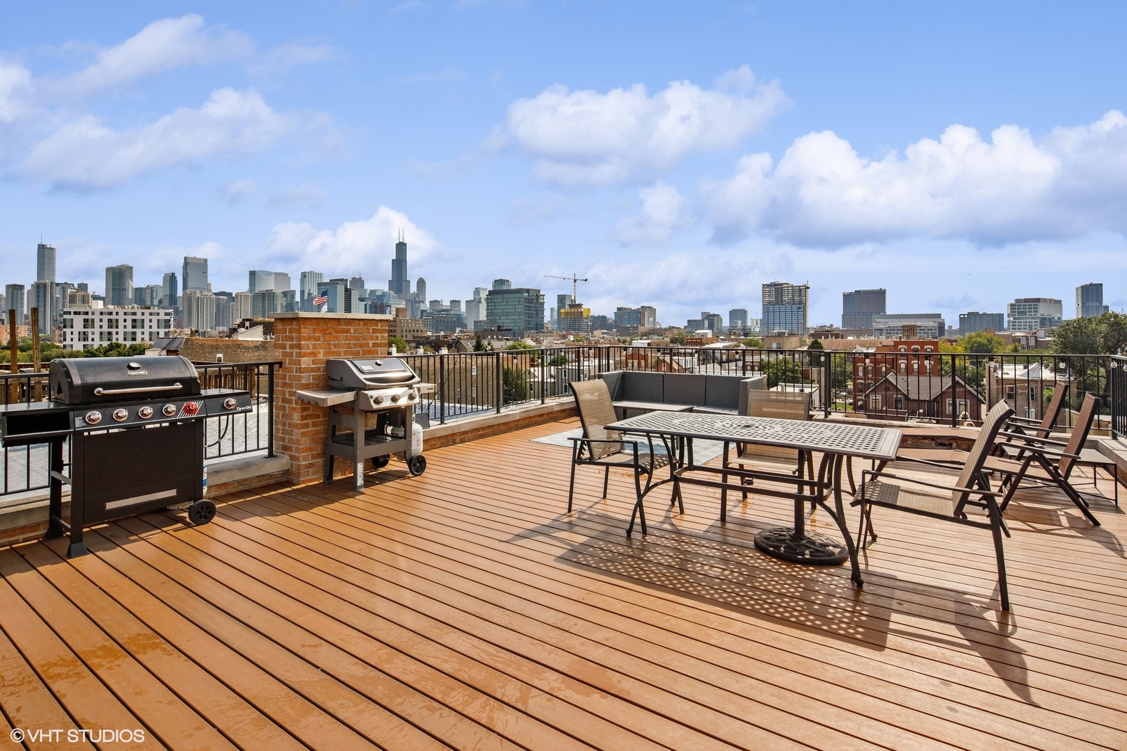 1326 West Huron Street, Unit 4 Chicago, IL 60642 - Photo 18 of 20 a view of a terrace with wooden benches