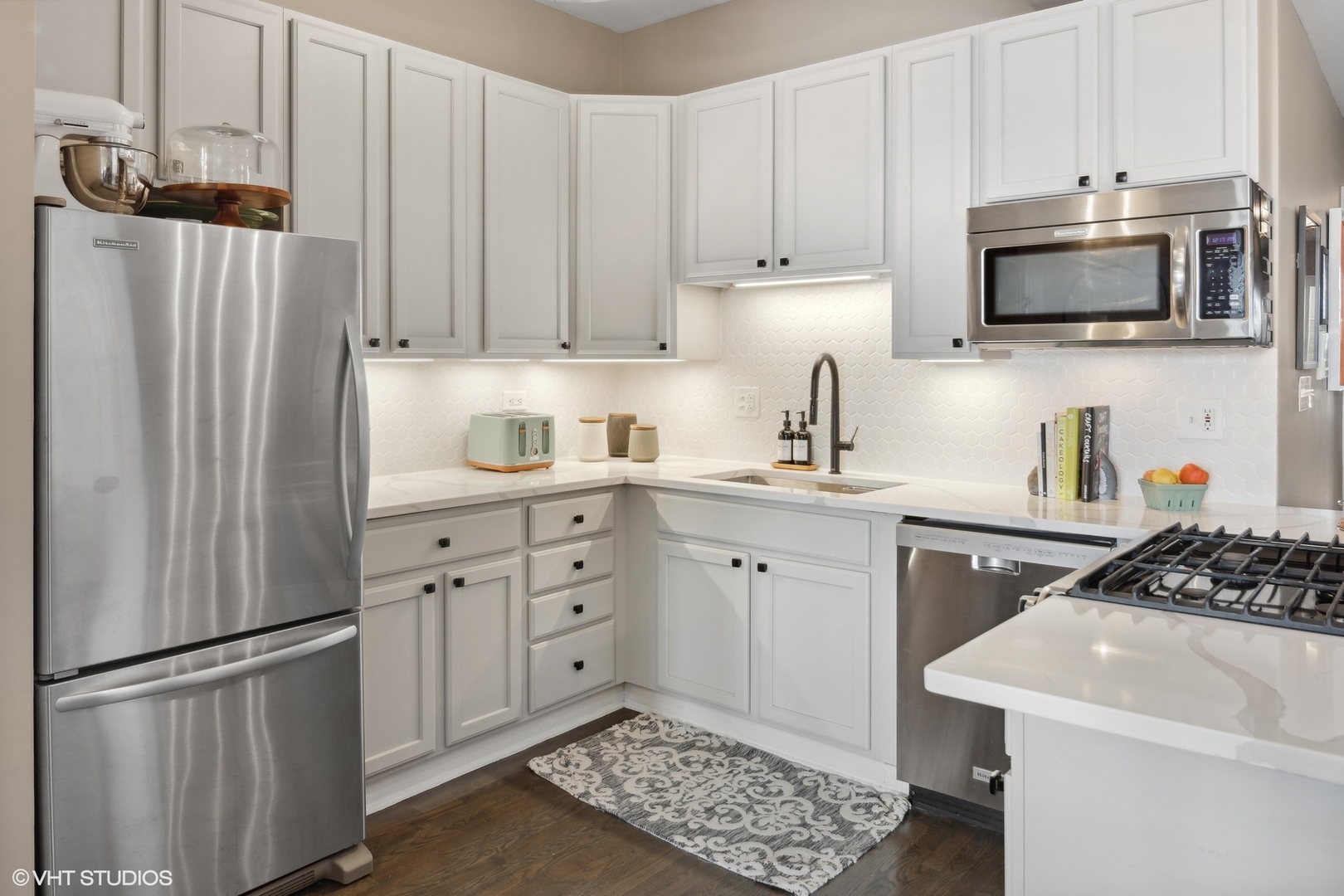 1326 West Huron Street, Unit 4 Chicago, IL 60642 - Photo 5 of 20 a kitchen with stainless steel appliances a refrigerator sink and microwave
