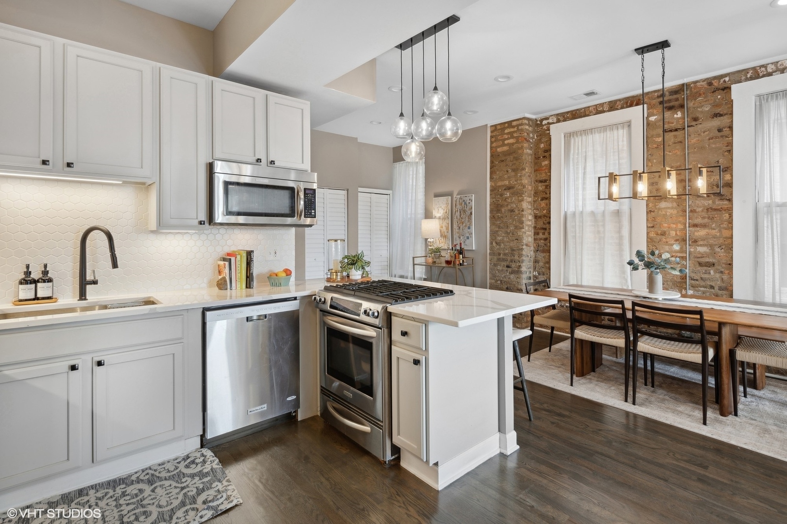 1326 West Huron Street, Unit 4 Chicago, IL 60642 - Photo 6 of 20 a view of kitchen with sink microwave and stove