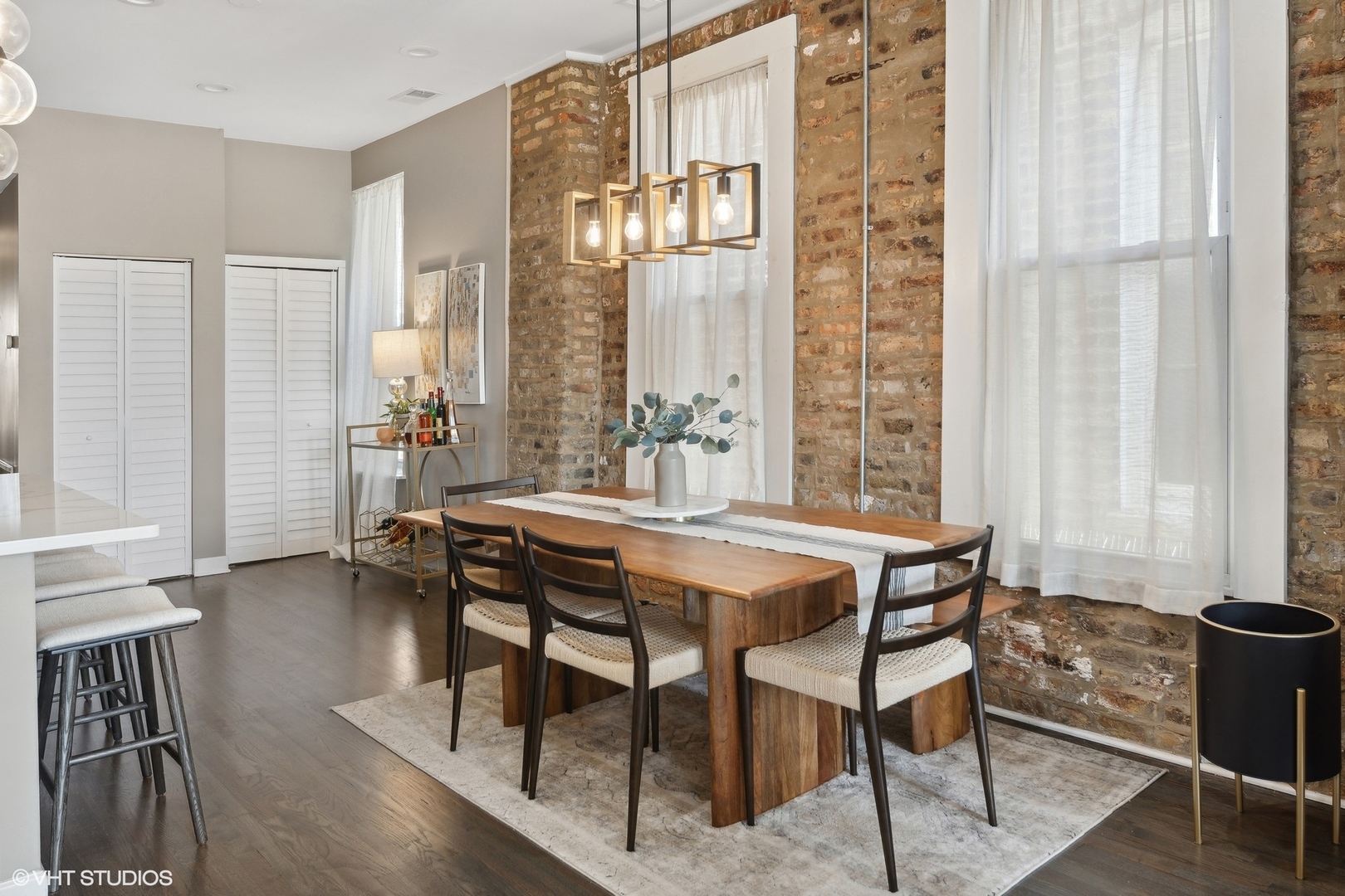 1326 West Huron Street, Unit 4 Chicago, IL 60642 - Photo 7 of 20 a dining room with furniture and wooden floor