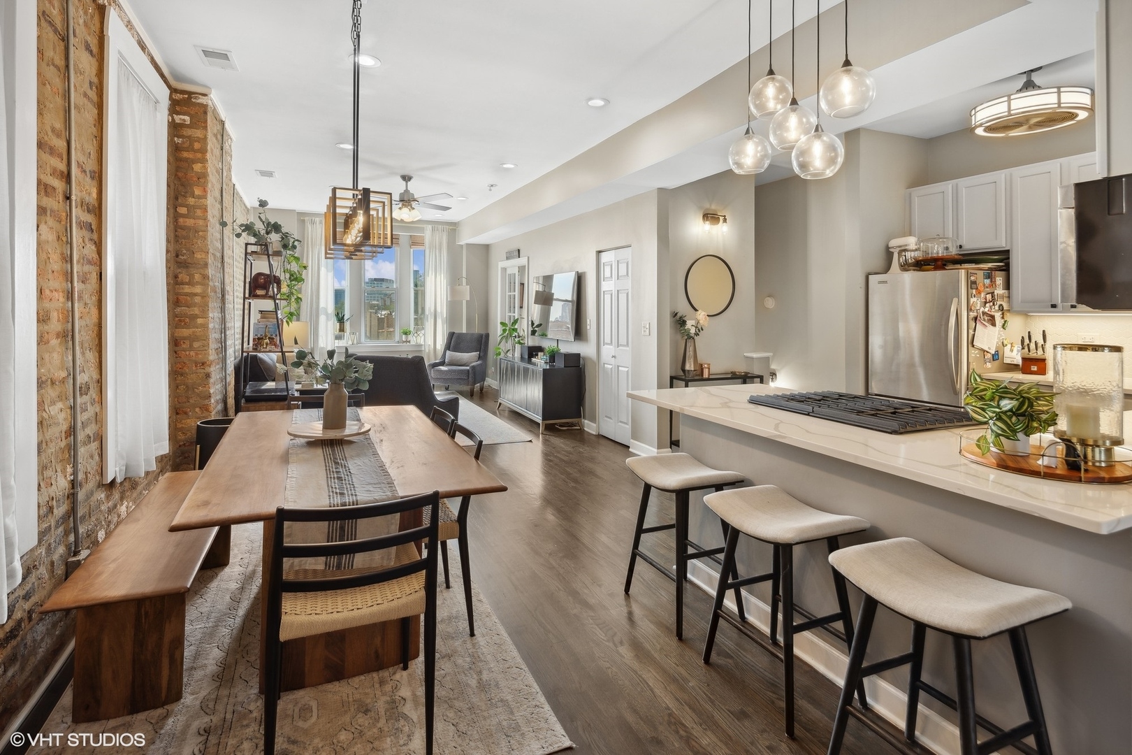 1326 West Huron Street, Unit 4 Chicago, IL 60642 - Photo 9 of 20 a large kitchen with a table and chairs