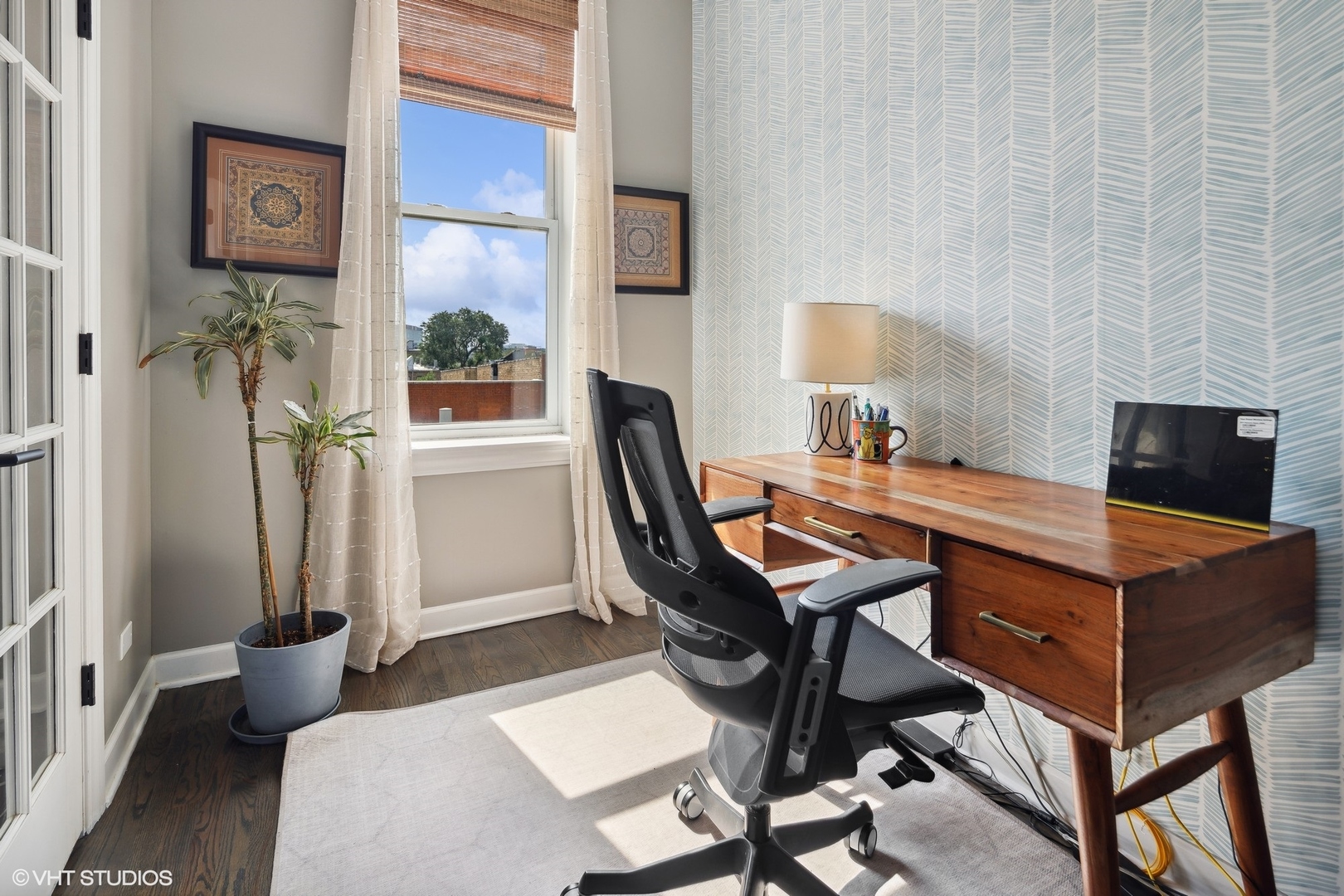 1326 West Huron Street, Unit 4 Chicago, IL 60642 - Photo 10 of 20 a room with a table chairs and a flat screen tv