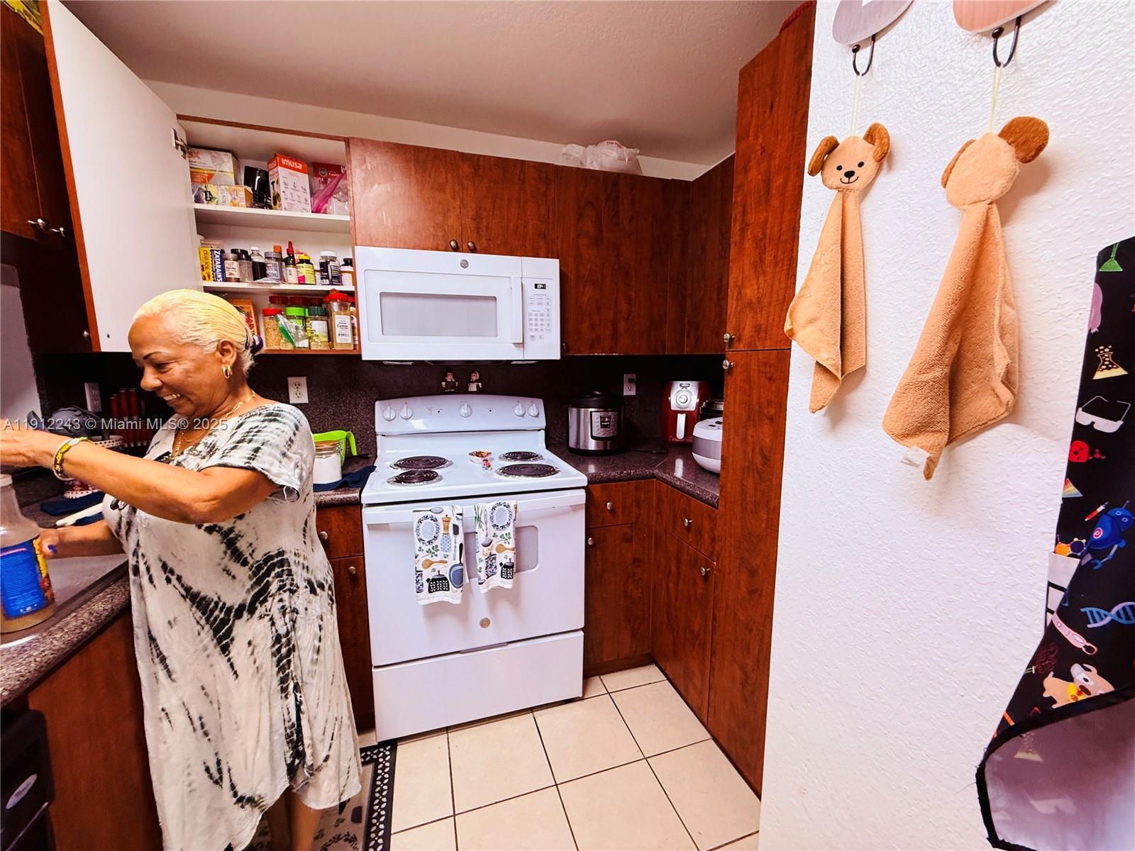 2243 Northwest 135th Terrace, Unit 2243 Opa-Locka, FL 33054 - Photo 8 of 19 a utility room with dryer and washer