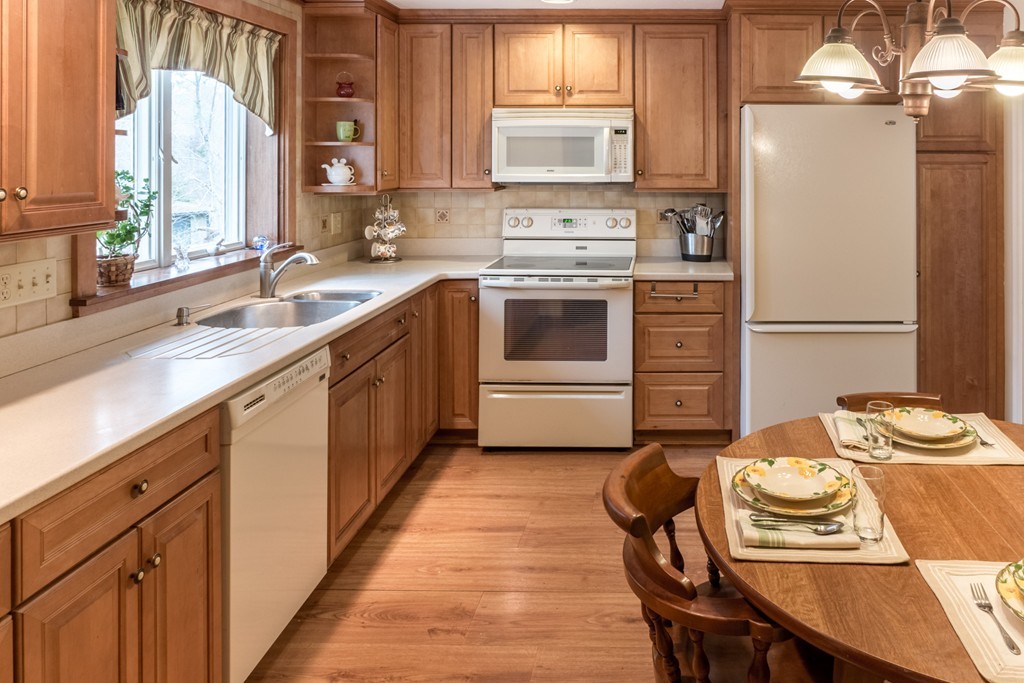 3 Surrey Lane Canton, MA 02021 - Photo 3 of 9 a kitchen with a sink stove and refrigerator