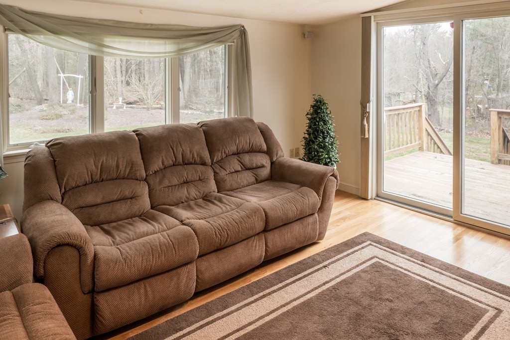 3 Surrey Lane Canton, MA 02021 - Photo 4 of 9 a living room with furniture and a large window