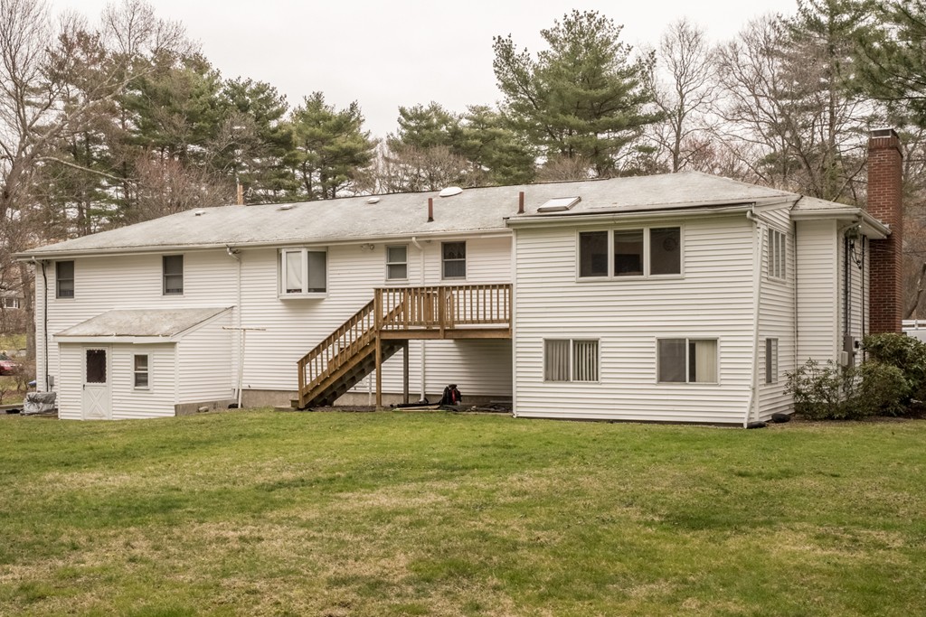 3 Surrey Lane Canton, MA 02021 - Photo 8 of 9 a view of a house with a backyard