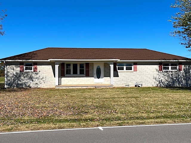 1291 Union Camp Road Lafayette, TN 37083 - Photo 1 of 28 a front view of a house with a garden