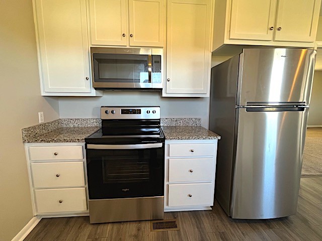 1291 Union Camp Road Lafayette, TN 37083 - Photo 10 of 28 a kitchen with granite countertop white cabinets and stainless steel appliances
