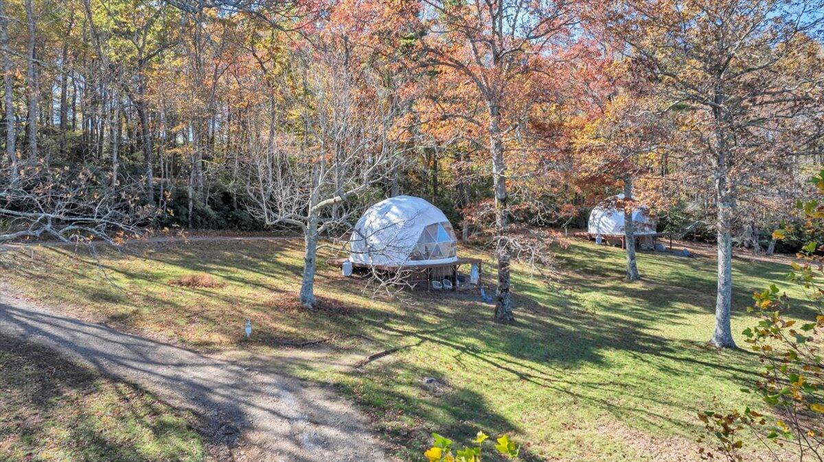 1533 Groundhog Mountain Road Hillsville, VA 24343 - Photo 116 of 132 a backyard of a house with table and chairs