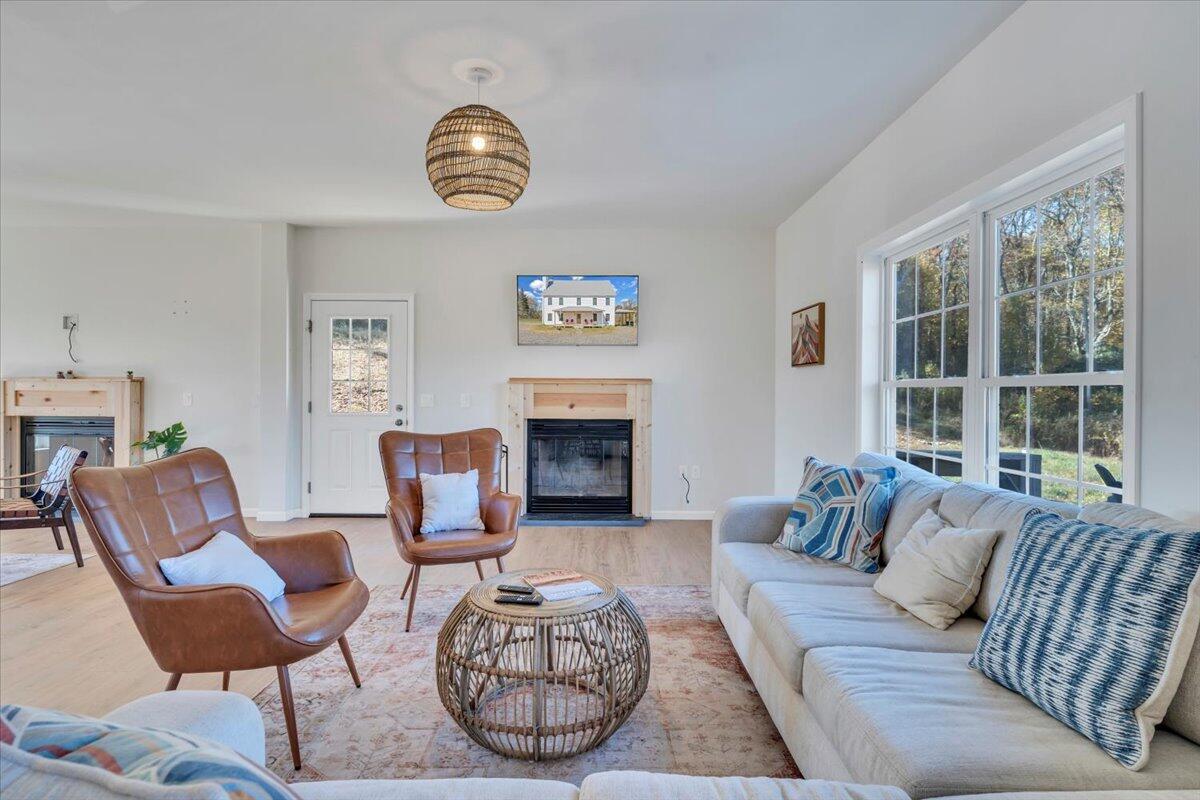 1533 Groundhog Mountain Road Hillsville, VA 24343 - Photo 23 of 132 a living room with furniture a fireplace and window