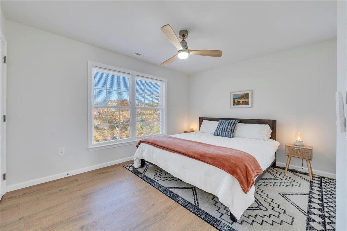 1533 Groundhog Mountain Road Hillsville, VA 24343 - Photo 34 of 132 a spacious bedroom with a bed and a window