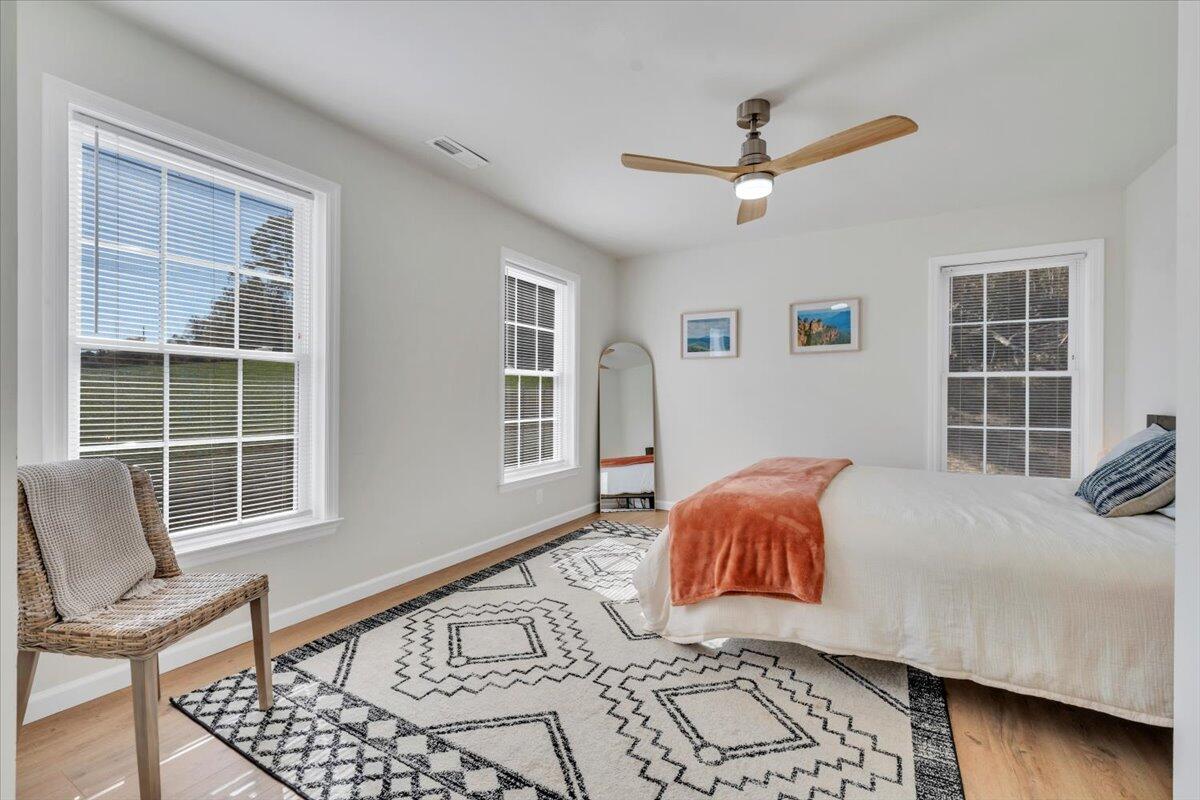 1533 Groundhog Mountain Road Hillsville, VA 24343 - Photo 46 of 132 a bedroom with a bed and wooden floor