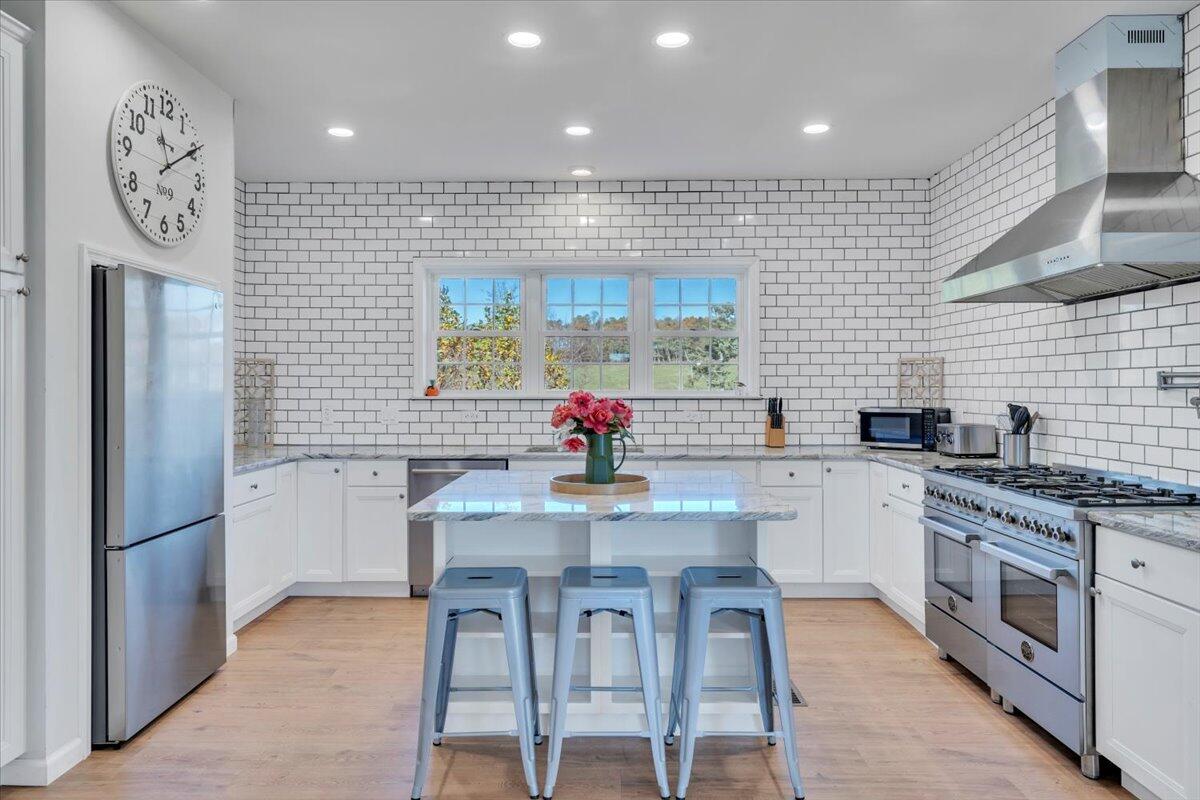 1533 Groundhog Mountain Road Hillsville, VA 24343 - Photo 6 of 132 a kitchen with stainless steel appliances granite countertop a dining table chairs sink and cabinets