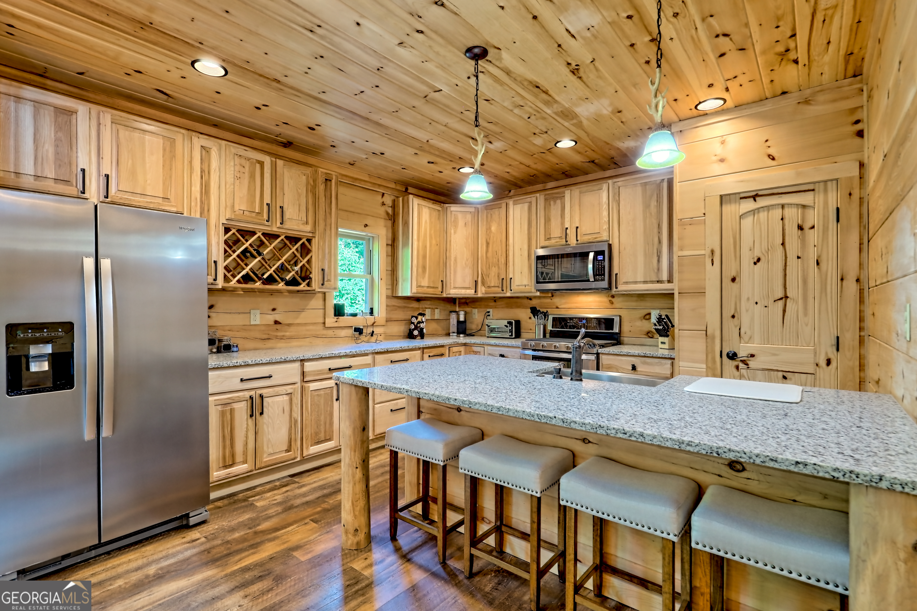 117 Ivy Rdg Way Clarkesville, GA 30523 - Photo 13 of 84 a kitchen with granite countertop stainless steel appliances a sink a counter top space cabinets and stainless steel appliances