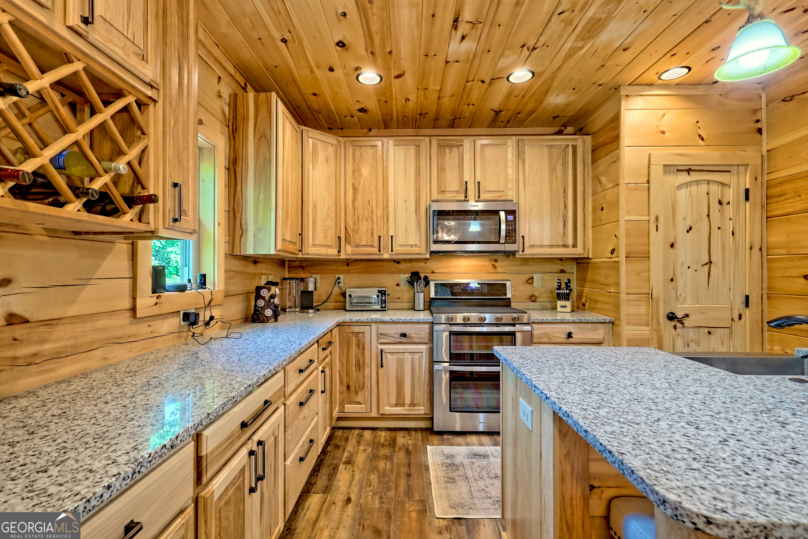 117 Ivy Rdg Way Clarkesville, GA 30523 - Photo 15 of 84 a kitchen with stainless steel appliances granite countertop a sink a stove top oven a counter space and cabinets