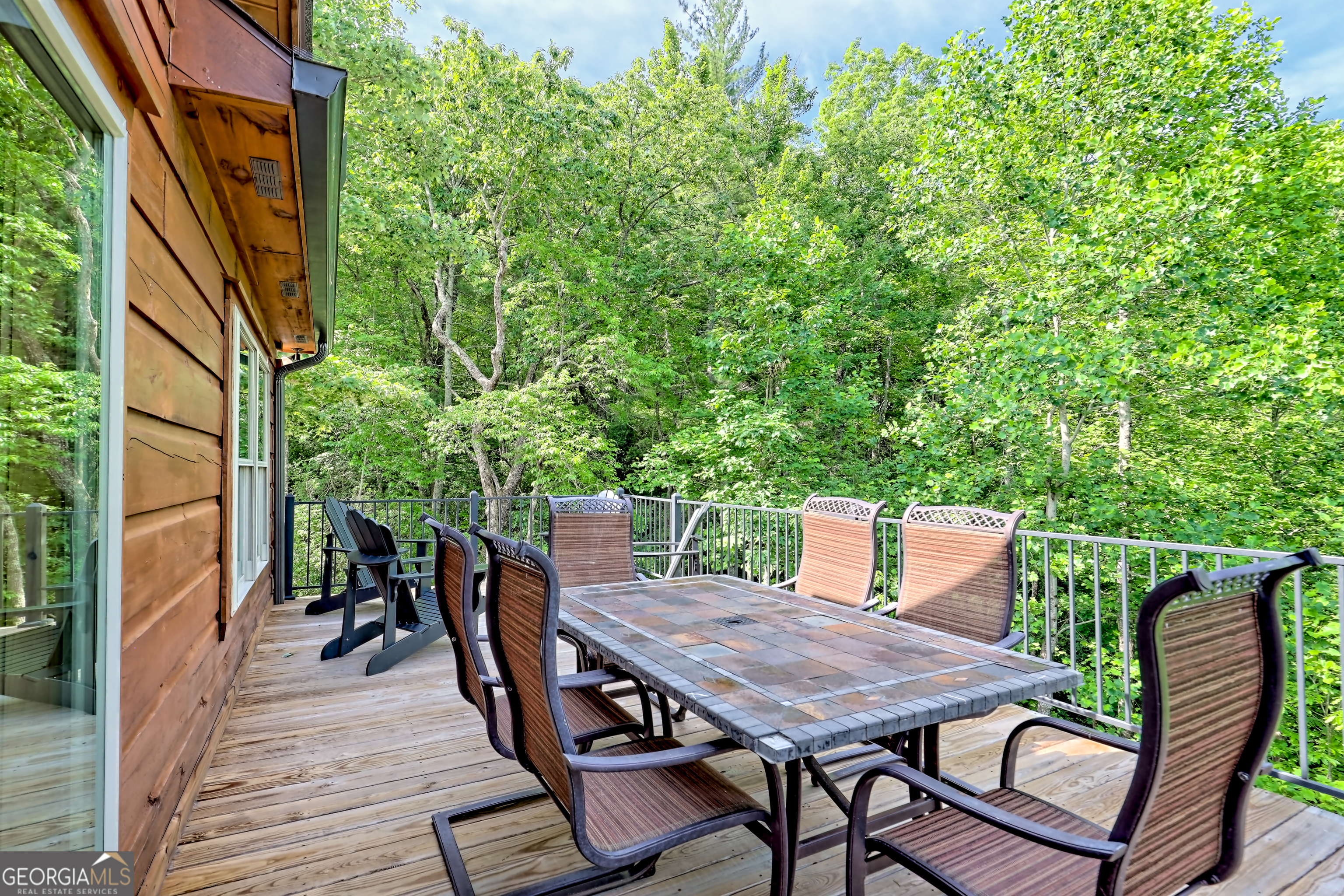 117 Ivy Rdg Way Clarkesville, GA 30523 - Photo 21 of 84 a view of a dinning tables and chairs in deck