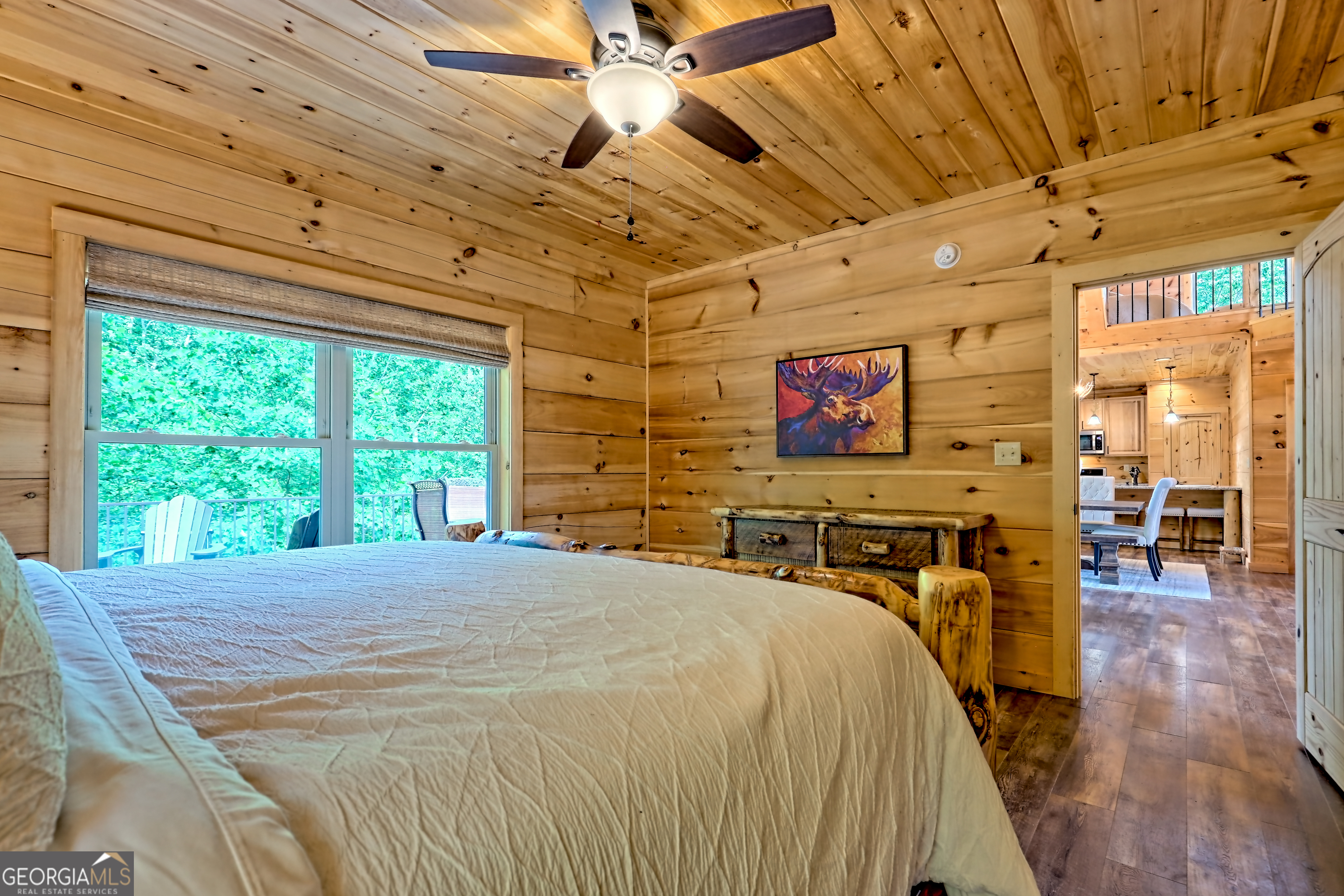 117 Ivy Rdg Way Clarkesville, GA 30523 - Photo 36 of 84 a bed sitting in a bedroom next to a window