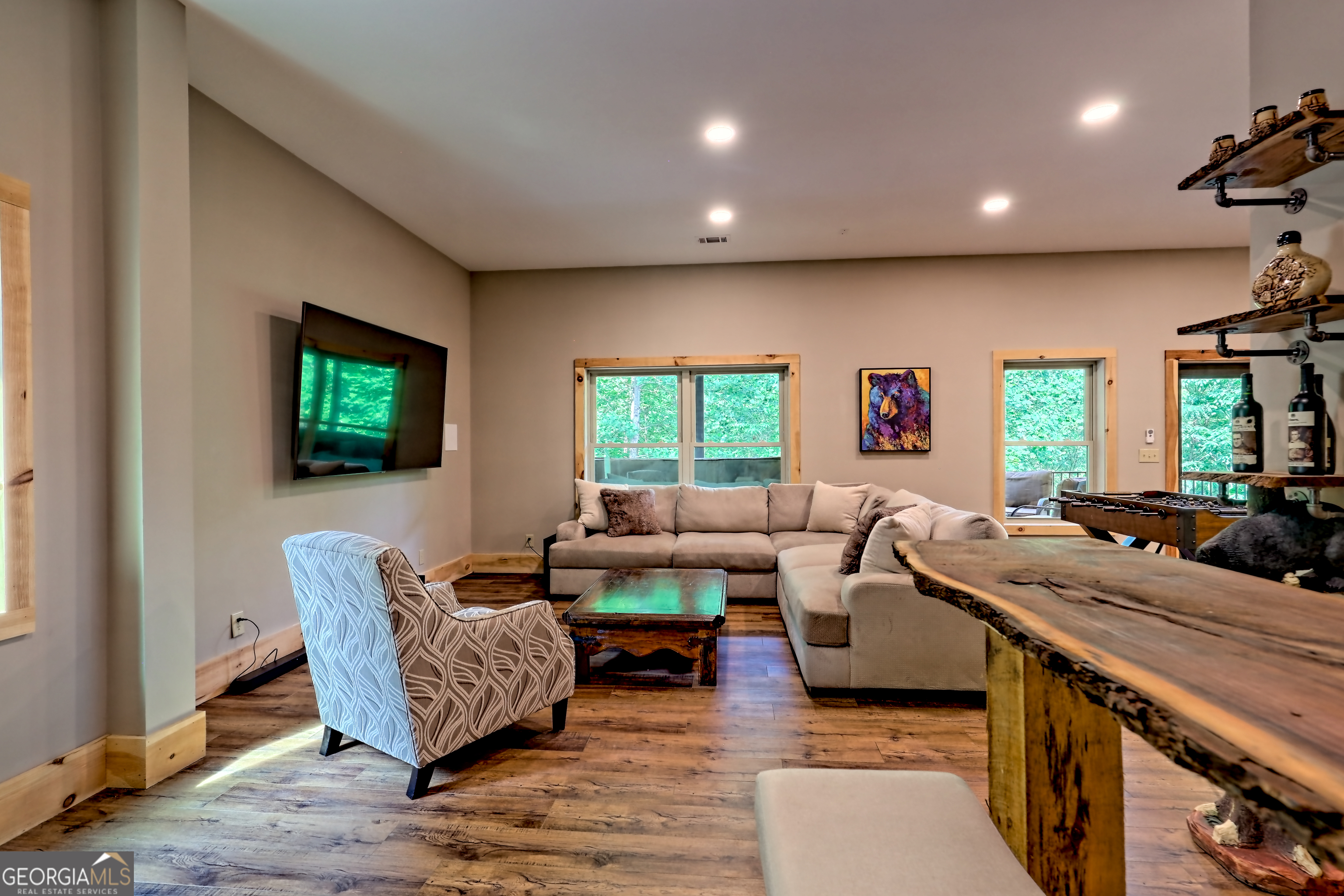 117 Ivy Rdg Way Clarkesville, GA 30523 - Photo 55 of 84 a living room with furniture and a flat screen tv