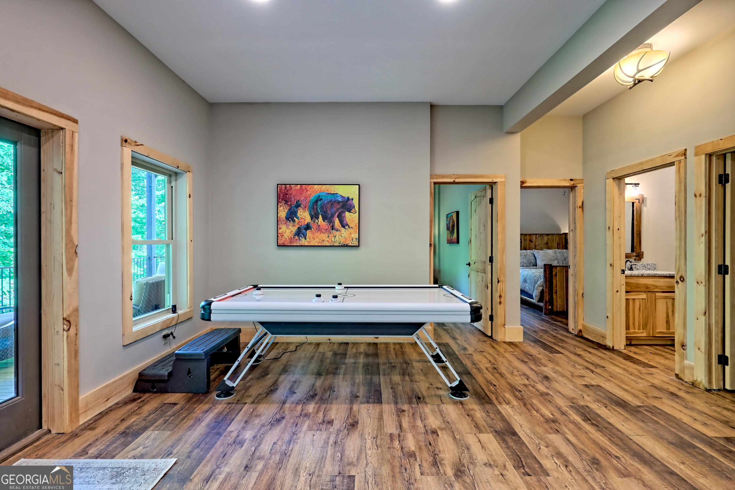 117 Ivy Rdg Way Clarkesville, GA 30523 - Photo 60 of 84 a living room with furniture pool table wooden floor and a large window