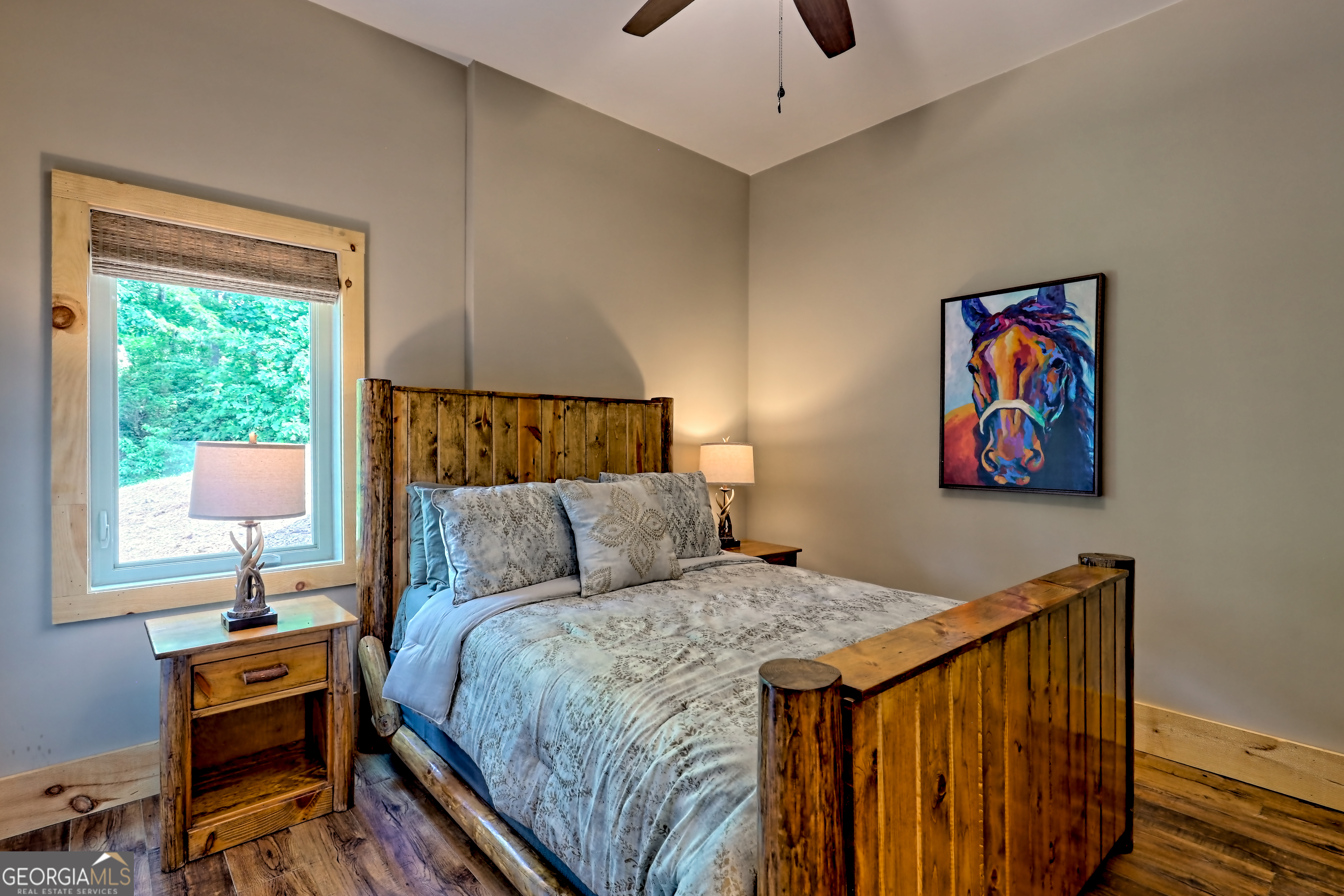 117 Ivy Rdg Way Clarkesville, GA 30523 - Photo 62 of 84 a bedroom with a bed and a lamp on dresser