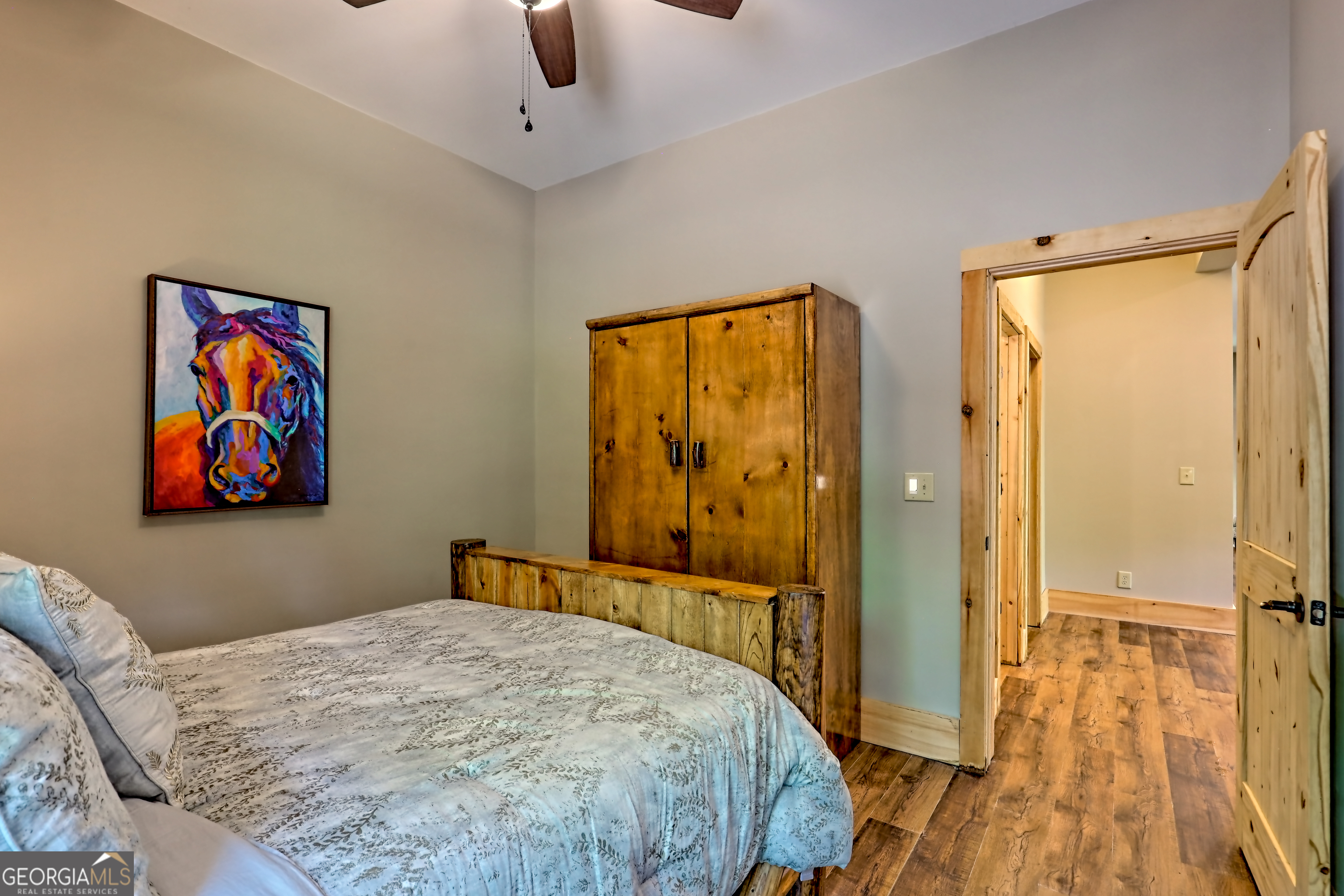 117 Ivy Rdg Way Clarkesville, GA 30523 - Photo 63 of 84 a bedroom with a bed and a painting on the wall