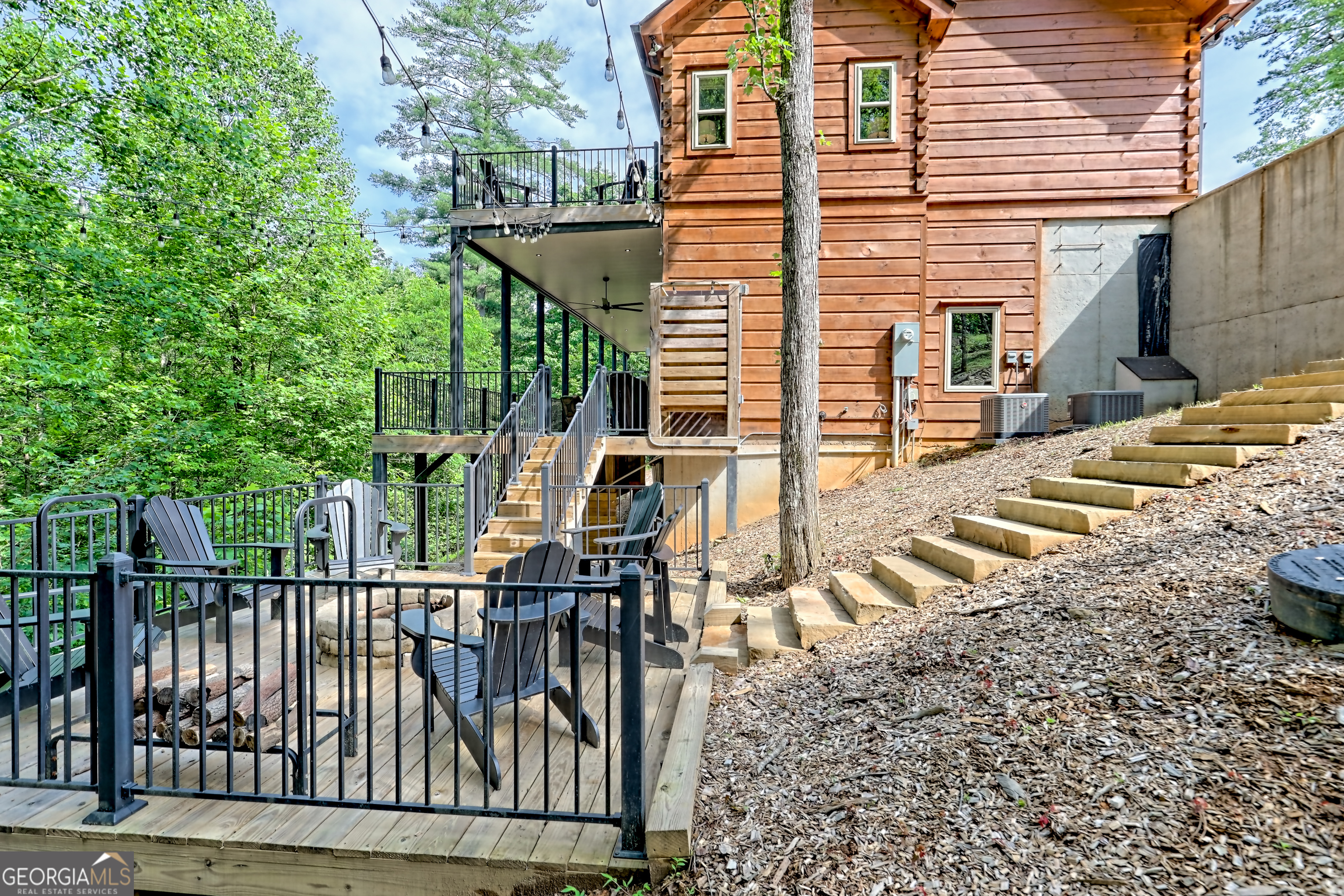 117 Ivy Rdg Way Clarkesville, GA 30523 - Photo 79 of 84 a view of a patio with table and chairs with wooden fence and plants
