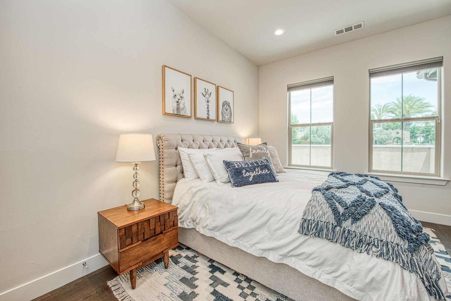 1632 North De Wolf Avenue Clovis, CA 93619 - Photo 14 of 80 a bedroom with a bed a lamp and a window