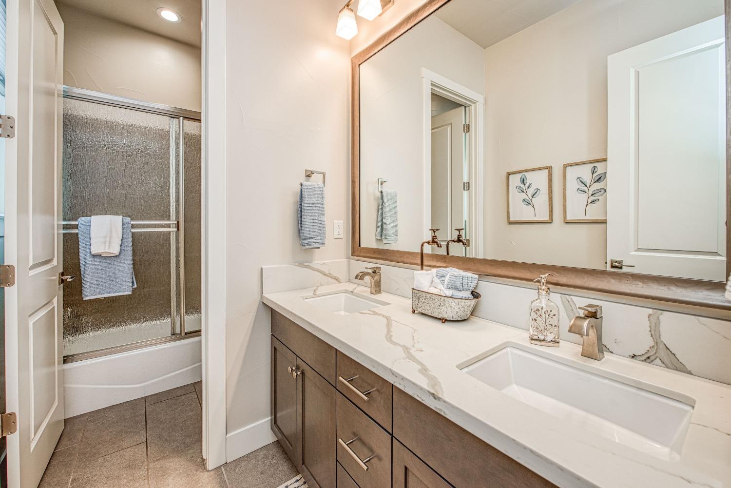 1632 North De Wolf Avenue Clovis, CA 93619 - Photo 16 of 80 a bathroom with a sink and a mirror