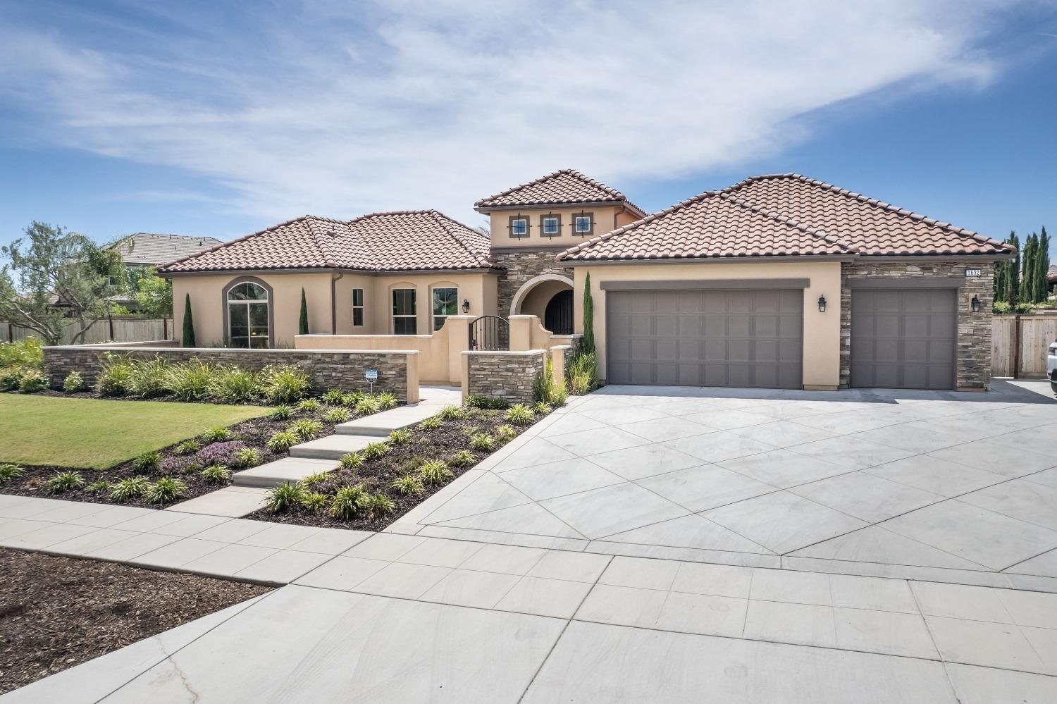 1632 North De Wolf Avenue Clovis, CA 93619 - Photo 2 of 80 a front view of a house with a yard