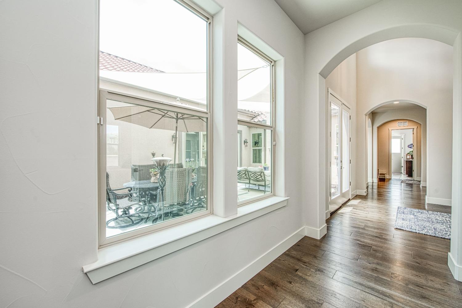 1632 North De Wolf Avenue Clovis, CA 93619 - Photo 21 of 80 a view of a room with wooden floor and a window