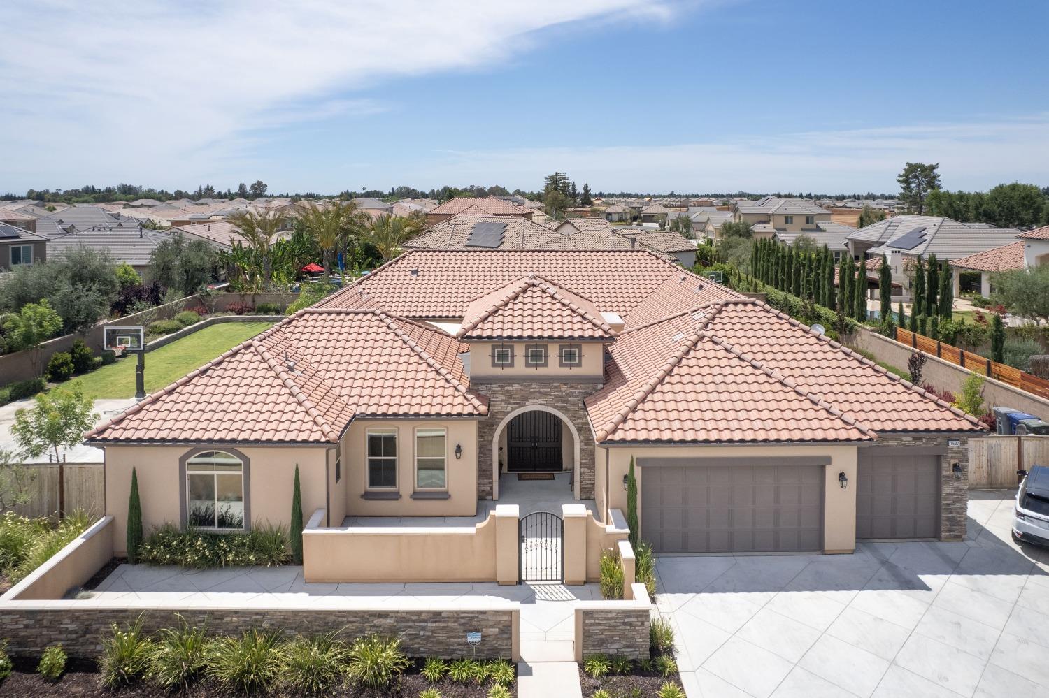 1632 North De Wolf Avenue Clovis, CA 93619 - Photo 3 of 80 a front view of a house with a yard