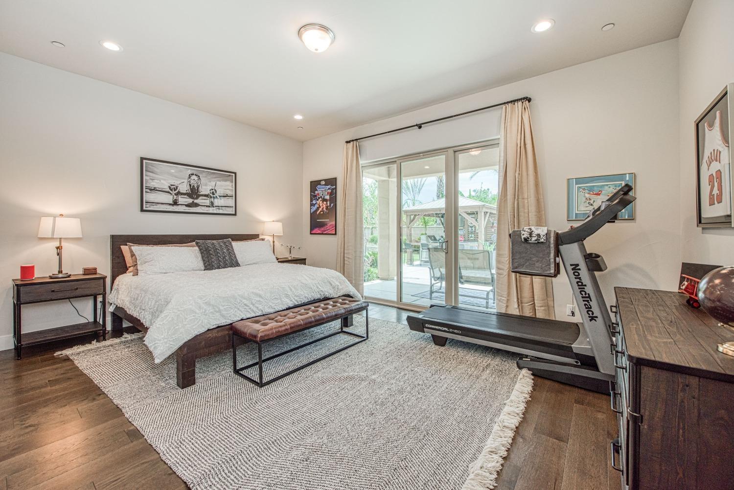 1632 North De Wolf Avenue Clovis, CA 93619 - Photo 31 of 80 a spacious bedroom with a bed and a desk