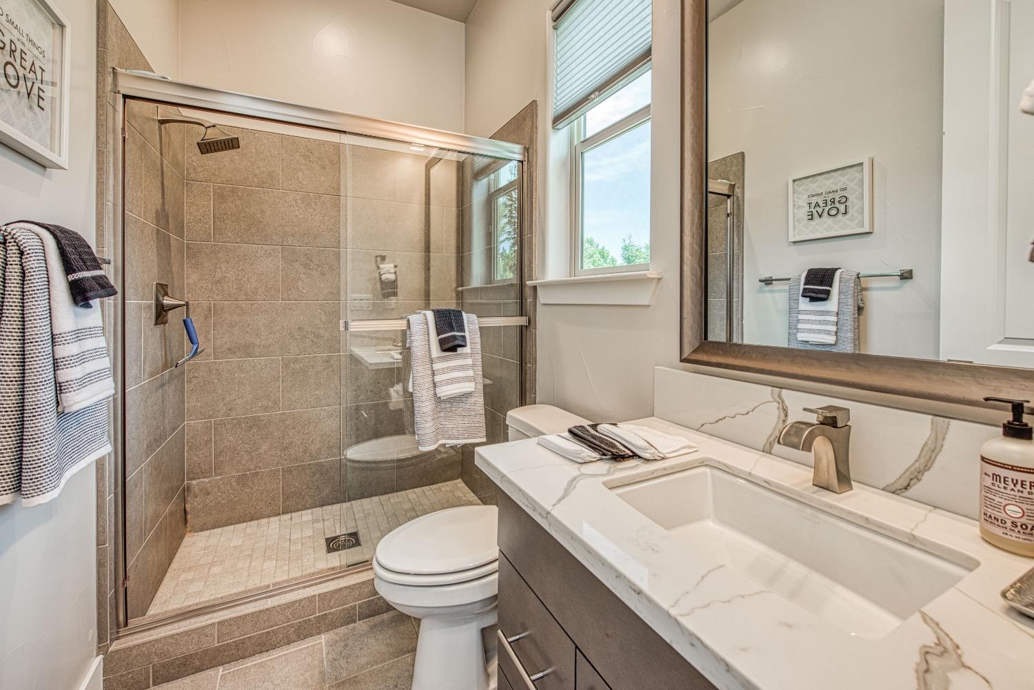 1632 North De Wolf Avenue Clovis, CA 93619 - Photo 33 of 80 a bathroom with a sink toilet and shower