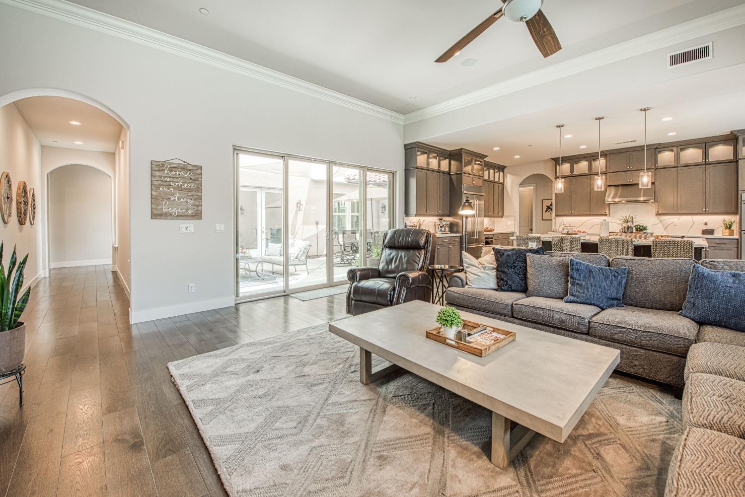 1632 North De Wolf Avenue Clovis, CA 93619 - Photo 49 of 80 a living room with furniture large windows and wooden floor
