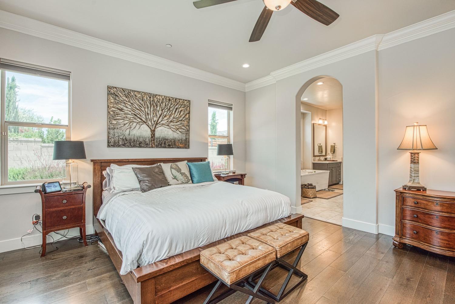 1632 North De Wolf Avenue Clovis, CA 93619 - Photo 54 of 80 a bedroom with a bed and wooden floor