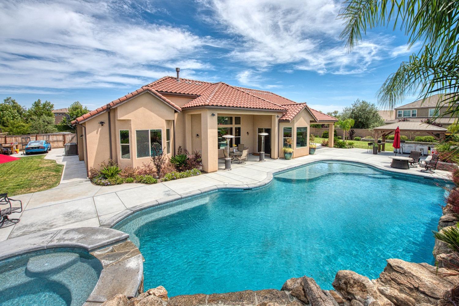 1632 North De Wolf Avenue Clovis, CA 93619 - Photo 67 of 80 a view of a house with a yard patio and sitting area