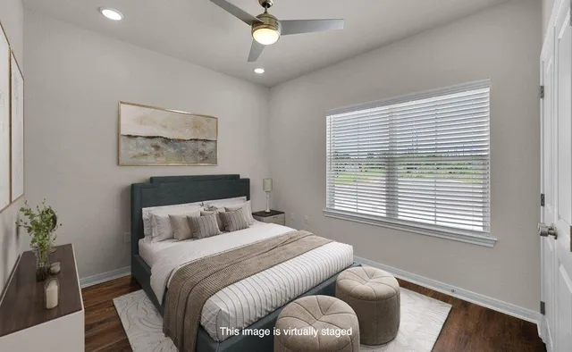 a bedroom with furniture and a window