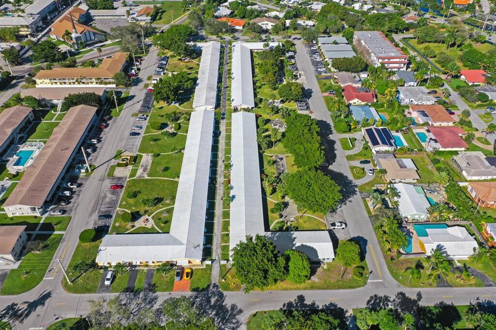 3801 Northeast 22nd Terrace, Unit 2 Lighthouse Point, FL 33064 - Photo 18 of 19 an aerial view of multi story residential apartment building with yard and parking space