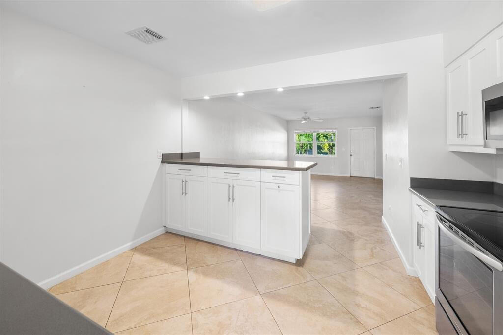 3801 Northeast 22nd Terrace, Unit 2 Lighthouse Point, FL 33064 - Photo 5 of 19 a view of a kitchen with a sink