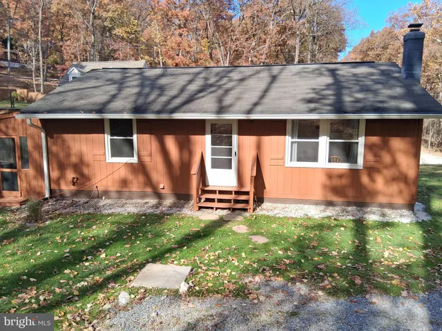 a backyard of a house with garden