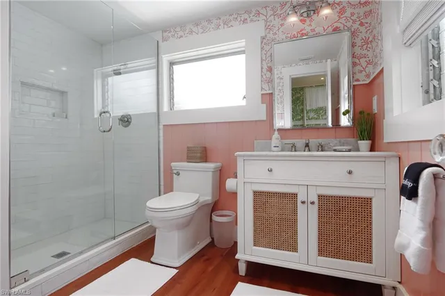 a bathroom with a sink toilet and shower