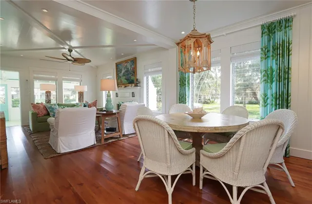 a dining room with furniture window wooden floor