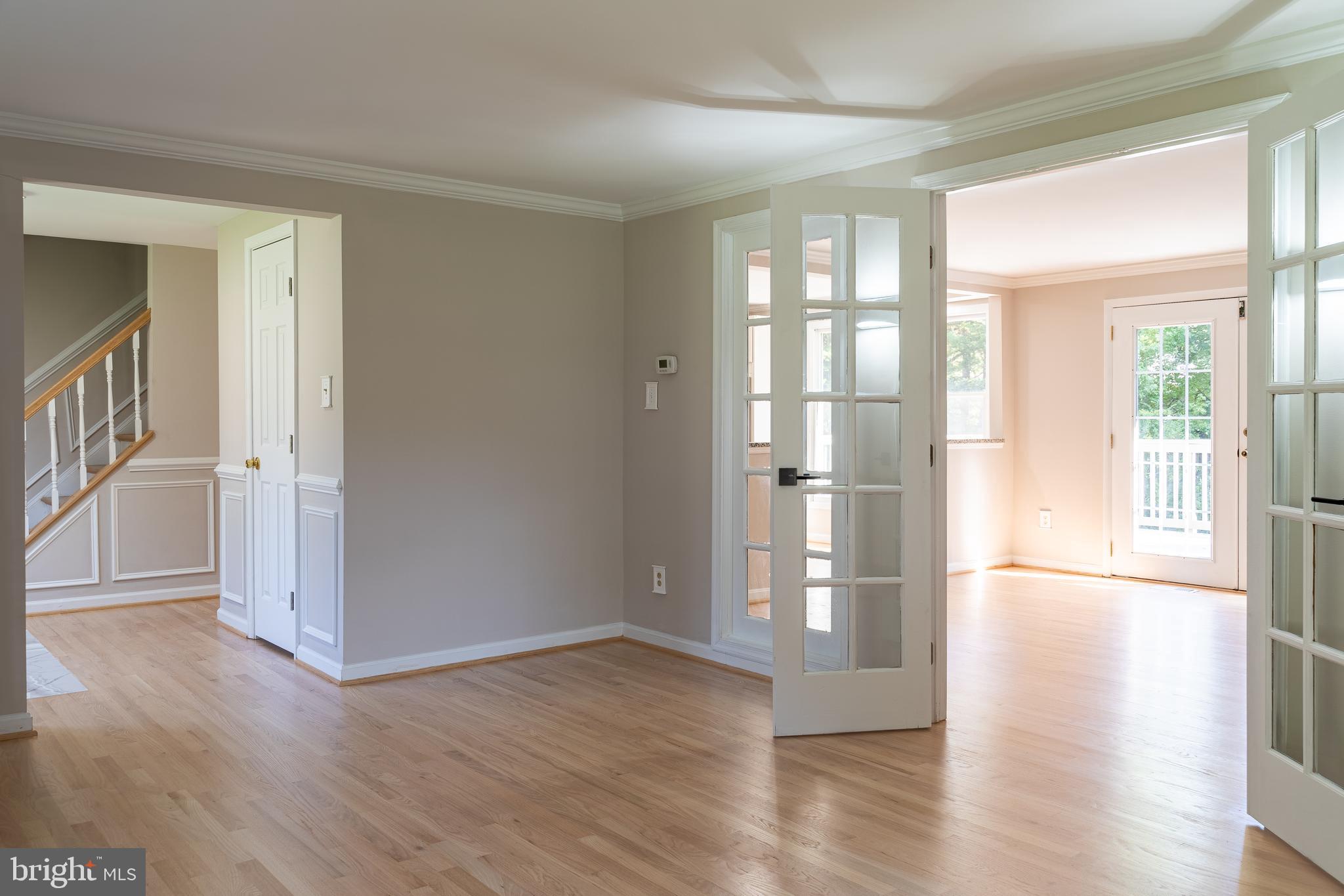14913 Lear Lane Silver Spring, MD 20905 - Photo 13 of 34 a view of empty room with wooden floor and fan