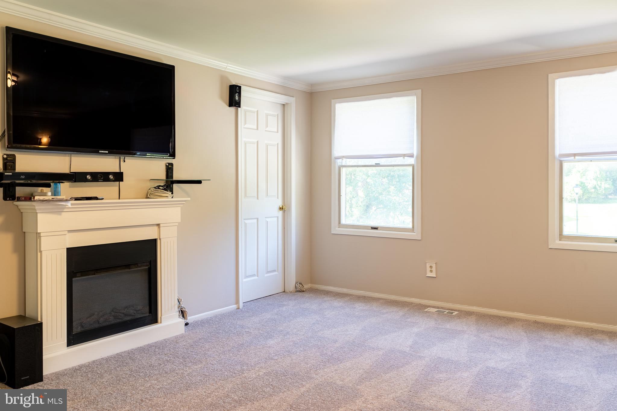 14913 Lear Lane Silver Spring, MD 20905 - Photo 14 of 34 a view of livingroom with furniture a fireplace and flat screen tv