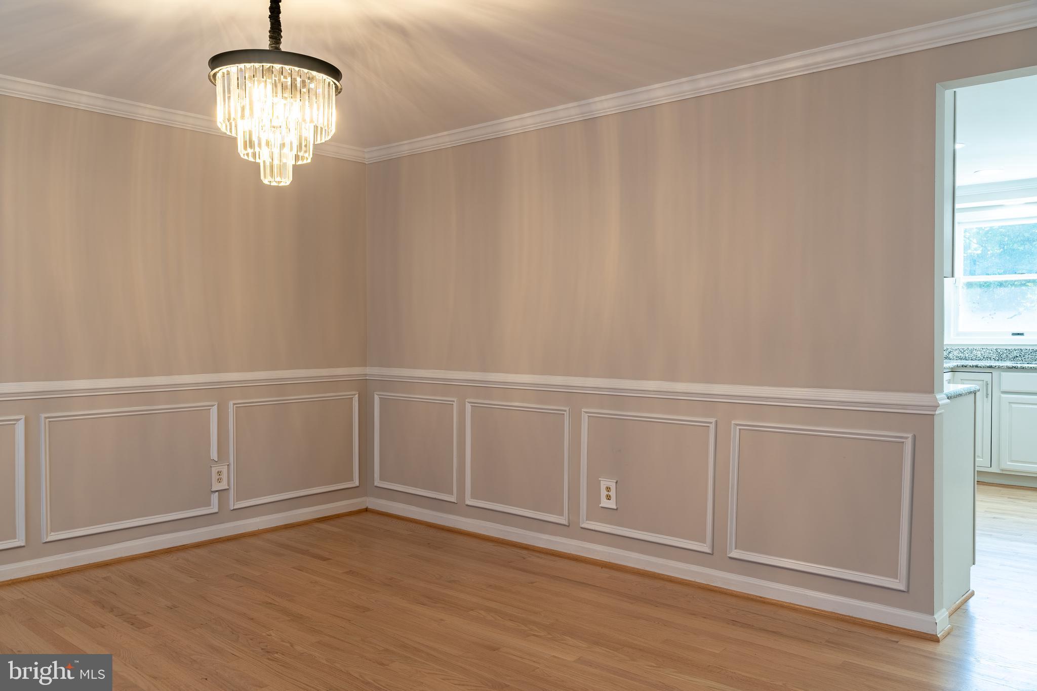 14913 Lear Lane Silver Spring, MD 20905 - Photo 3 of 34 a view of an empty room with wooden floor and a window
