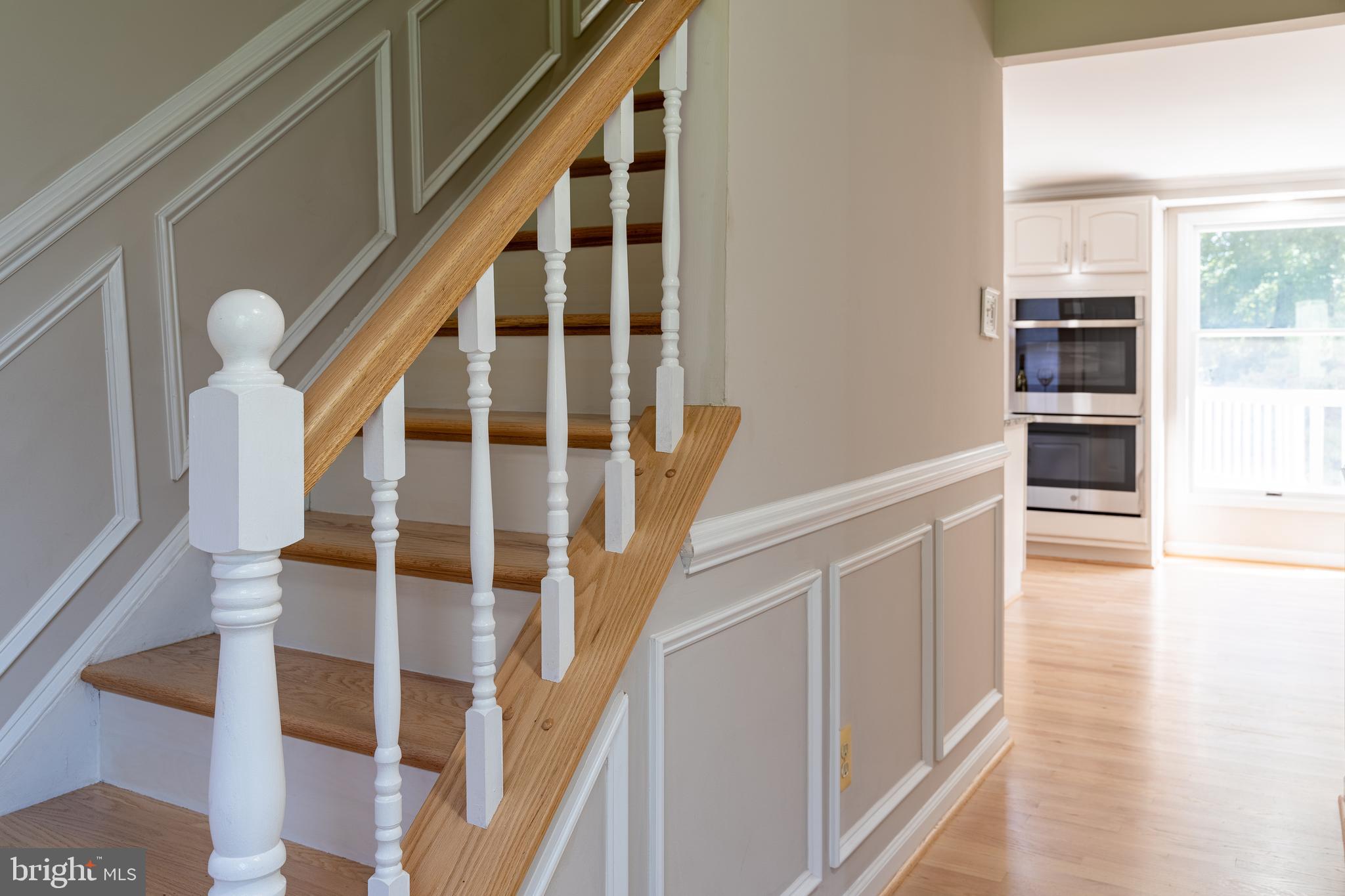 14913 Lear Lane Silver Spring, MD 20905 - Photo 4 of 34 a view of staircase with lots of wooden floor and windows