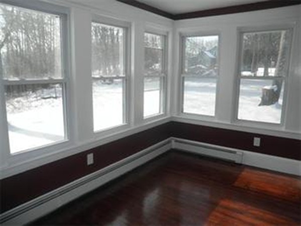 3233 Boston Road Wilbraham, MA 01095 - Photo 8 of 18 a view of an empty room with wooden floor and a window