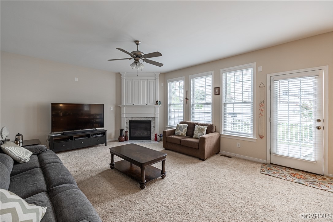9500 Meadowview Road Henrico, VA 23294 - Photo 13 of 49 a living room with furniture a flat screen tv and a fireplace