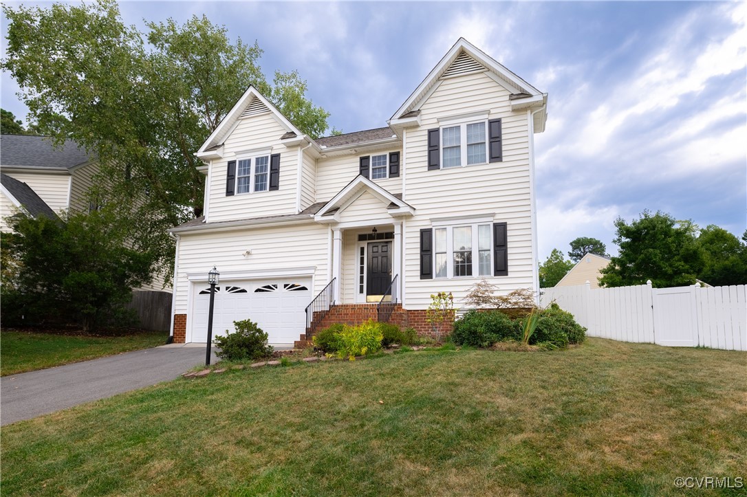 9500 Meadowview Road Henrico, VA 23294 - Photo 2 of 49 a front view of a house with a yard and garage